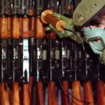 Bosnian Serb Army soldier measures levels of radiation on weapons and army equipment at a military factory in eastern Bosnian town of Bratunac 40 miles (65 kms) southeast of Tuzla, Bosnia-Herzeovina Wednesday, Jan 17, 2001. Amel Emric/AP.