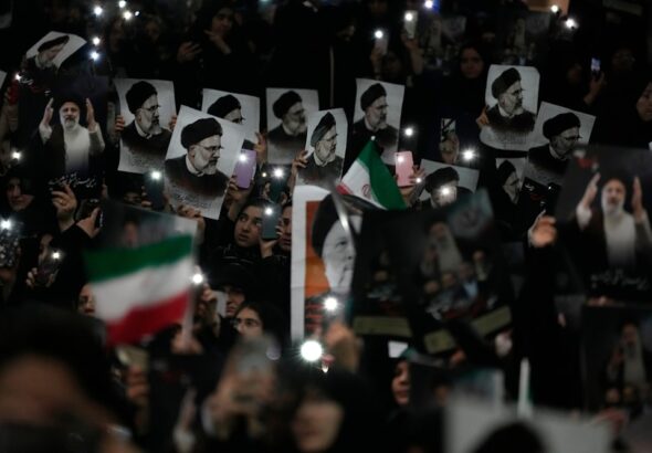 Mourners hold posters of the late Iranian President Ebrahim Raisi at the Imam Khomeini Grand Mosque compound in Tehran, May 21, 2024. Photo: AP.