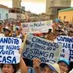 Far-right opposition supporters in Venezuela during a political rally holding banners with reference to the "comanditos." Photo: El Nacional.