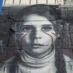 Giant mural of a girl in the side of a building. Photo: International reporters/file photo.