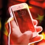 a hand holding an iPhone with a backdrop of the Chinese flag. Photo: Morning Star.