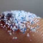 Person's thumbnail with microplastic on it. Photo: Getty images/File photo.