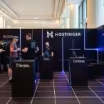 Featured image: Hostinger booth at WordCamp 23' Athens. Photo: Glassdoor/File photo.