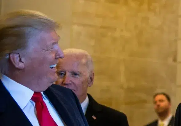 Donald Trump and Joe Biden wait to exit the east front steps for the departure ceremony during the 58th Presidential Inauguration in Washington, D.C., Jan. 20, 2017. Photo: Staff Sgt. Marianique Santos/Public Domain.