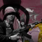 Young (eyes covered) kid holding a machine gun. Photo: Zainab Termos/Al Mayadeen.