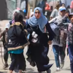 Palestinians run during Israeli bombardment in Rafah in the southern Gaza Strip on June 19, 2024. Photo: AFP.