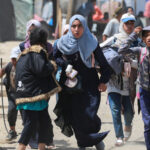 Palestinians run during Israeli bombardment in Rafah in the southern Gaza Strip on June 19, 2024. Photo: AFP.