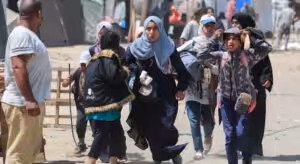 Palestinians run during Israeli bombardment in Rafah in the southern Gaza Strip on June 19, 2024. Photo: AFP.