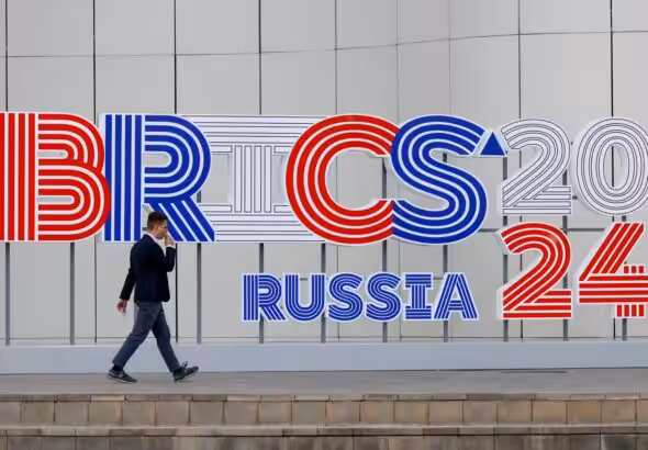 A man walks outside the venue hosting the BRICS foreign ministers meeting, in Nizhny Novgorod, Russia, June 9, 2024. Photo: Reuters.