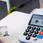 A Venezuelan voter registers his fingerprints after voting. File photo.