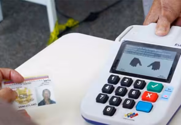 A Venezuelan voter registers his fingerprints after voting. File photo.