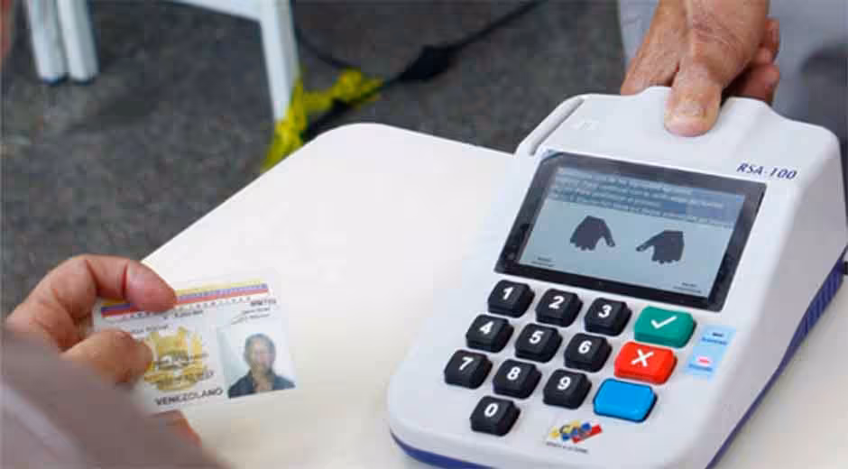 A Venezuelan voter registers his fingerprints after voting. File photo.