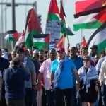 Cuban President Miguel Díaz-Canel (center) and First Lady Lis Cuesta march in a pro-Palestine demonstration in Havana, Cuba, November 23, 2023. Photo: AP.