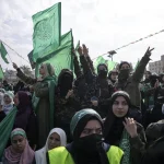 Women supporters of the Palestinian resistance movement Hamas attend a rally marking the 35th annivesary of the founding of the organization, in Gaza City, December 14, 2022. Photo: Fatima Shbair/AP.