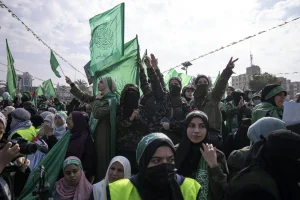Women supporters of the Palestinian resistance movement Hamas attend a rally marking the 35th annivesary of the founding of the organization, in Gaza City, December 14, 2022. Photo: Fatima Shbair/AP.