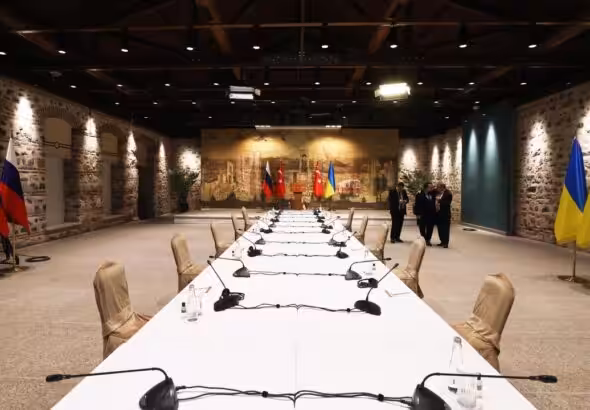 Negotiation talks table with the flags of Turkey, Russia and Ukraine Photo: Sputnik/file photo.