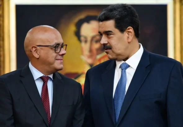 Venezuela's National Assembly President Jorge Rodríguez (left) and President Nicolás Maduro with a Simón Bolívar portrait in the background at Miraflores Palace, Caracas, Venezuela on June 2019. Photo: Matias de la Croix/Getty Images/file photo.