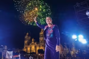 With fireworks in the background, Mexican-elect President Claudia Sheinbaum greets the crowd gathering at the Zocalo in Mexico City to hear her victory speech in the early morning of Monday, June 3, 2024. Photo: X/@mario_delgado.