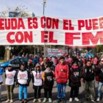 Argentinians hold a banner that reads "The debt is with the people, not with the IMF," a recurrent slogan in protests in Argentina, referring to the country's external debt and the IMF's neoliberal austerity. File photo.