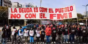 Argentinians hold a banner that reads "The debt is with the people, not with the IMF," a recurrent slogan in protests in Argentina, referring to the country's external debt and the IMF's neoliberal austerity. File photo.