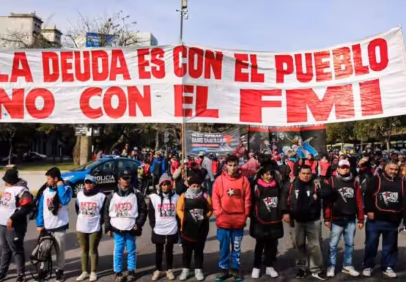 Argentinians hold a banner that reads "The debt is with the people, not with the IMF," a recurrent slogan in protests in Argentina, referring to the country's external debt and the IMF's neoliberal austerity. File photo.