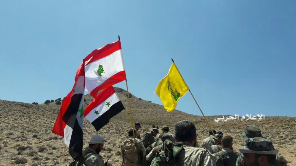 Hezbollah fighters and Syrian army units take control of a position outside Qalamoun at the Syria-Lebanon border during a battle with ISIS in 2017. Photo: Al-Manar TV.