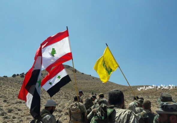 Hezbollah fighters and Syrian army units take control of a position outside Qalamoun at the Syria-Lebanon border during a battle with ISIS in 2017. Photo: Al-Manar TV.