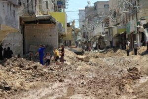 Palestinians inspect the damage following a raid by Israeli forces in the Tulkarm refugee camp in the northern occupied West Bank on 23 July. Photo: Mohammed Nasser/APA images.