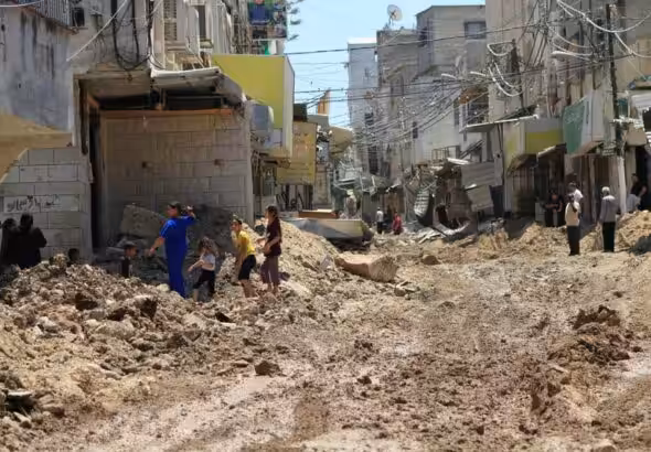Palestinians inspect the damage following a raid by Israeli forces in the Tulkarm refugee camp in the northern occupied West Bank on 23 July. Photo: Mohammed Nasser/APA images.