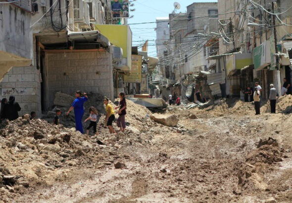 Palestinians inspect the damage following a raid by Israeli forces in the Tulkarm refugee camp in the northern occupied West Bank on 23 July. Photo: Mohammed Nasser/APA images.