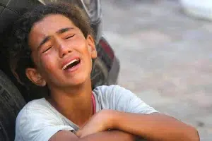 Relatives of 10-year-old Palestinian Mustafa Hijazi, who died due to malnutrition and lack of medication, mourns in Deir al-Balah, Gaza on June 14, 2024. Photo: Ashraf Amra/Anadolu Agency.