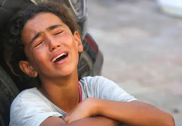 Relatives of 10-year-old Palestinian Mustafa Hijazi, who died due to malnutrition and lack of medication, mourns in Deir al-Balah, Gaza on June 14, 2024. Photo: Ashraf Amra/Anadolu Agency.