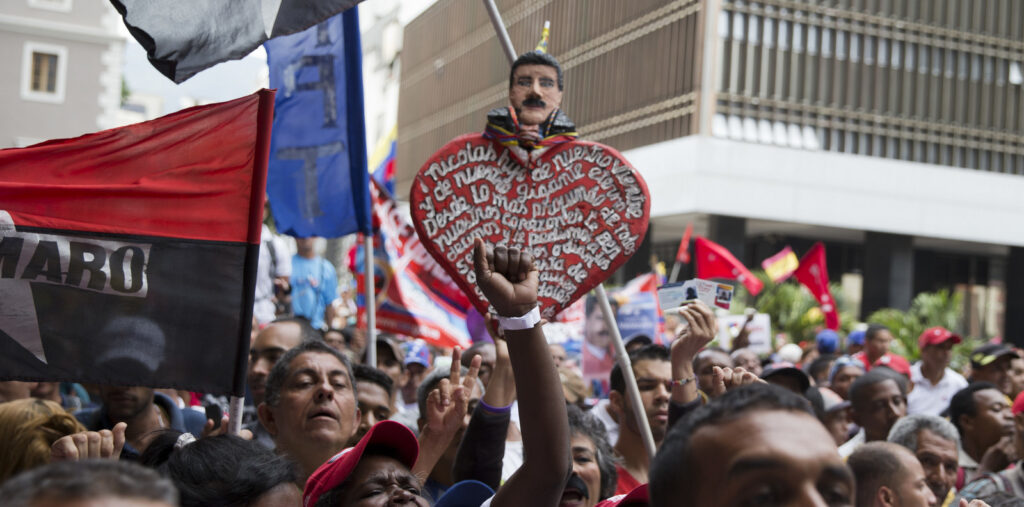 Supporters of Venezuela’s President Nicolas Maduro gather outside the National Electoral Council in Caracas, Venezuela, May 2, 2018. Photo: Ricardo Mazalan/AP.