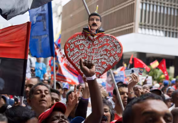 Supporters of Venezuela’s President Nicolas Maduro gather outside the National Electoral Council in Caracas, Venezuela, May 2, 2018. Photo: Ricardo Mazalan/AP.