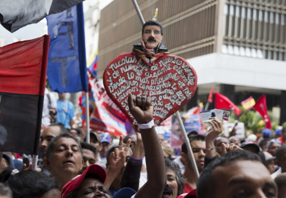 Supporters of Venezuela’s President Nicolas Maduro gather outside the National Electoral Council in Caracas, Venezuela, May 2, 2018. Photo: Ricardo Mazalan/AP.