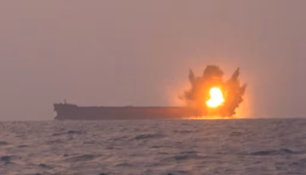 A screengrab from a video posted earlier by the Yemeni Military Media depicting the moment the Transworld Navigator ship was hit with a USV. Photo: YAF Military Media.