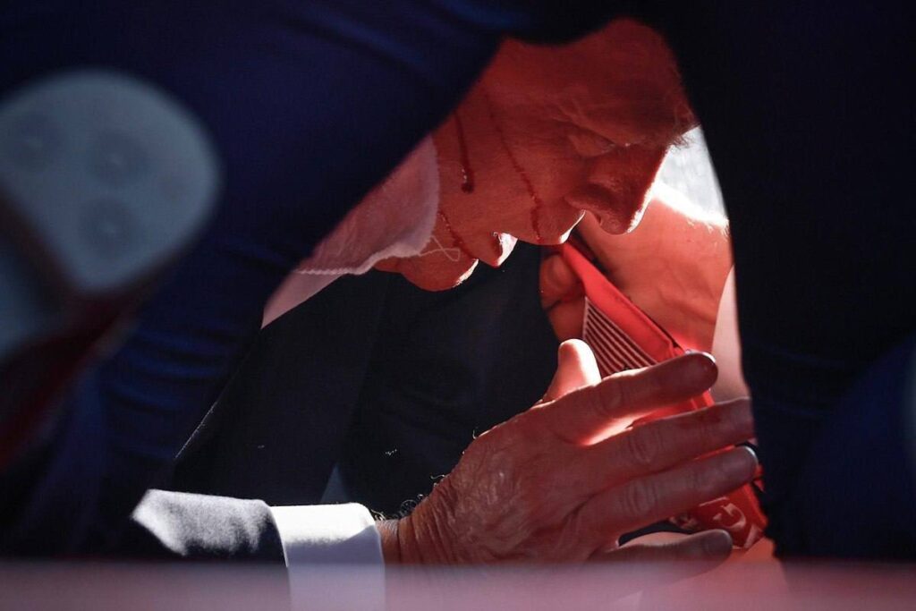 Former US president and presidential candidate Donald Trump on the floor and with blood on his head after a failed assassination attempt in Butler, Pennsylvania, on Saturday, July 13, 2024. Photo: Anna Moneymaker/Getty Images.