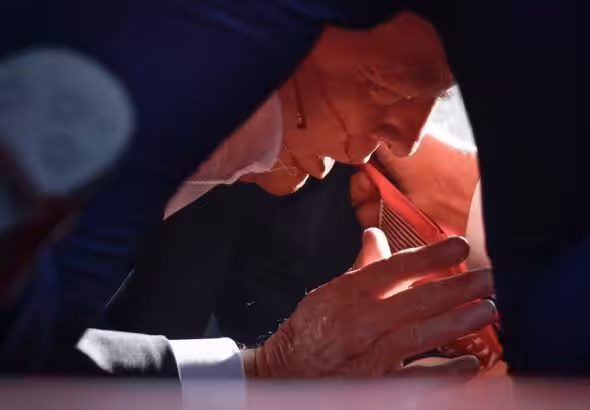 Former US president and presidential candidate Donald Trump on the floor and with blood on his head after a failed assassination attempt in Butler, Pennsylvania, on Saturday, July 13, 2024. Photo: Anna Moneymaker/Getty Images.