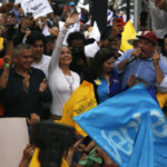María Corina Machado waves while campaigning for her surrogate, Edmundo González Urrutia, in Maracaibo, Venezuela, May 2, 2024. Photo: Humberto Matheus/Shutterstock.