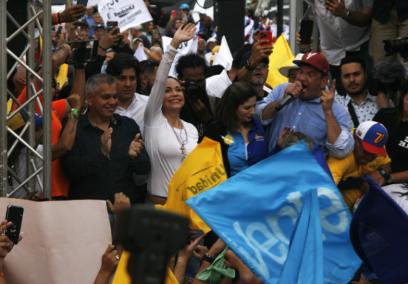 María Corina Machado waves while campaigning for her surrogate, Edmundo González Urrutia, in Maracaibo, Venezuela, May 2, 2024. Photo: Humberto Matheus/Shutterstock.