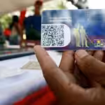 A person holding a Patria Card. File photo.