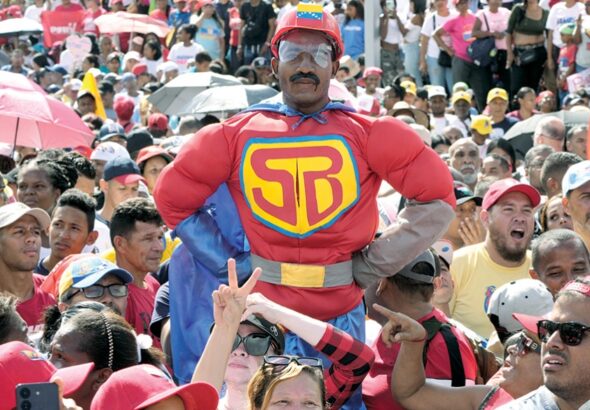 Deserved Adulation: A supporter dressed as ‘Super Bigote/Super Moustache’ a joyful reference to Nicolas Maduro’s ‘stash’ - the cartoon superhero appeared at a campaign rally in Caracas, Venezuela, July 18 2024 Photo: Ariana Cubillos/AP Photo.