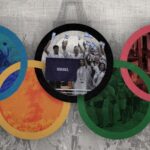 Photo composition showing Paris Olympics 2024 inauguration ceremony with the Eiffel Tower in the background overlapped with the Olympics rings containing images of the Israeli genocide against Palestinians. Photo: The Cradle.