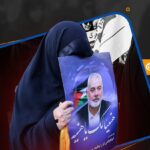 A woman holds a picture of martyred Hamas leader Ismail Haniyeh. Photo: Al-Mayadeen.