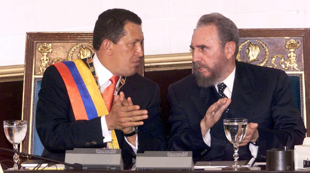 Cuban President Fidel Castro (right) and Venezuelan President Hugo Chávez (left) during the Cuban leader's state visit to Venezuela, October 27, 2000. Photo: Juan Barreto/AFP via Getty Images.