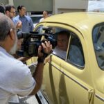 Former far-right presidential candidate Edmundo Gonzalez, posing for a photo from inside a German yellow Volkswagen Beetle, during a photo shoot for his presidential campaign. Photo: X/@rohernandezm_.