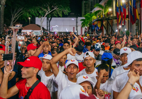 People in Caracas, Venezuela cheer on Nicolás Maduro's speech on victory night outside Miraflores palace. Photo: Zoe Alexandra/People’s Dispatch