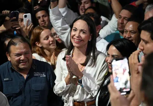 Venezuelan extreme-right politician María Corina Machado among supporters. Photo: AFP.