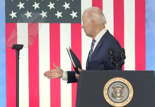US President Joe Biden appearing to reach out for a handshake, despite nobody being on stage with him. Thursday, April 14, 2022. Photo: WFMY/File photo.
