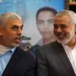 Yahya Sinwar, the head of the Hamas political bureau, laughs alongside martyred Hamas Leader Ismail Haniyeh. Undated. Photo: Social Media.